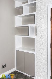 Contemporary style alcove bookshelves with cupboard, built in and hand painted in estate eggshell