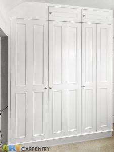 Bi-fold doors traditional style fitted wardrobe