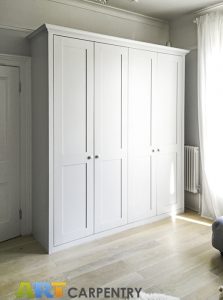 Shaker style fitted living room wardrobe