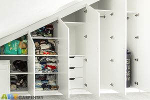 Contemporary MDF sloping wardrobe fitted in the loft spare room