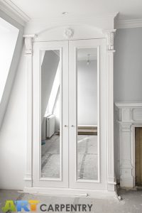 A gorgeous wardrobe with nice wood-carved corbels and French rosette